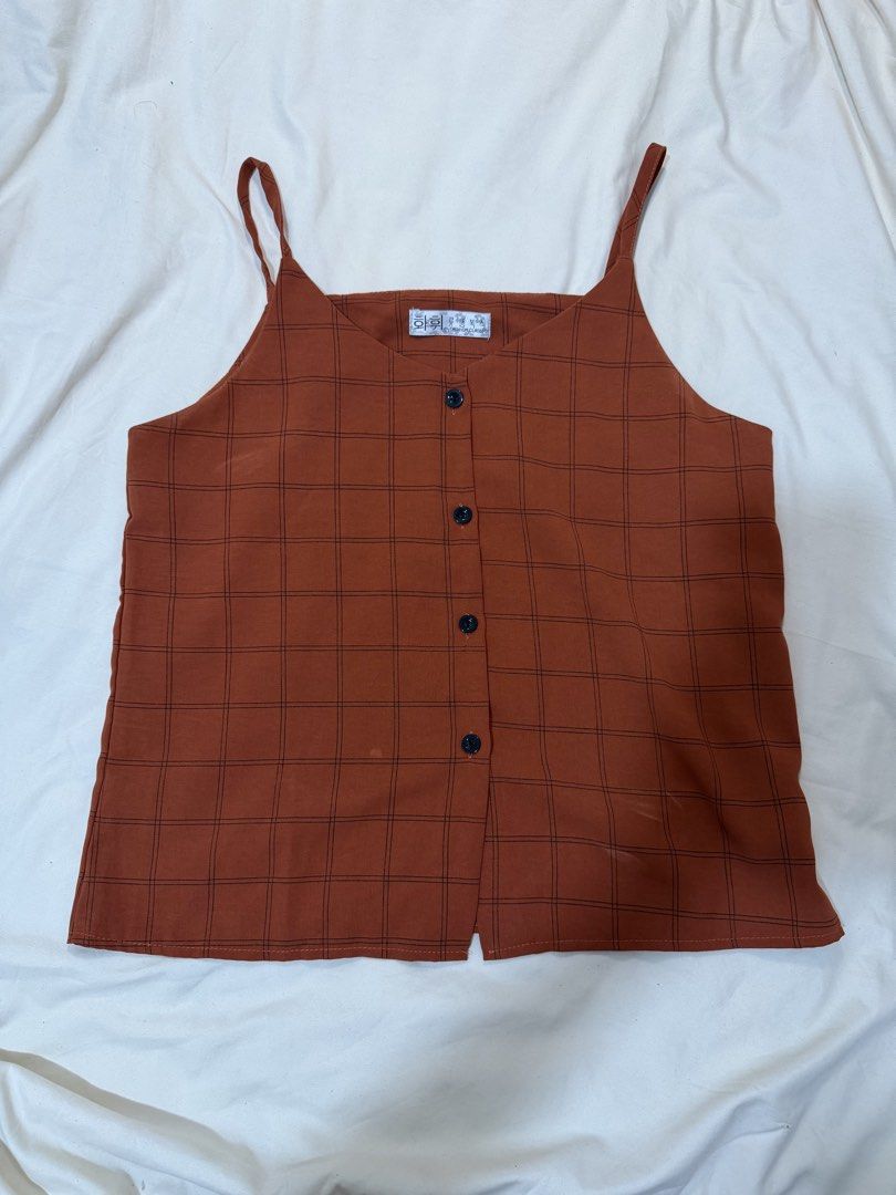 Rust Orange Plaid Button-Front Cami Top / Casual Tank (Category: Sleeveless) located in Manila. Submitted by stephscorner (Listing ID 1463292241, Image 2). Description: 🤎 Rust Orange Plaid Button-Front Cami Top Cute and easy-to-style sleeveless cami top in a warm rust/orange shade with a subtle black windowpane plaid pattern and contrasting black buttons. Features a relaxed straight fit that pairs easily with white shorts, denim, skirts, or trou