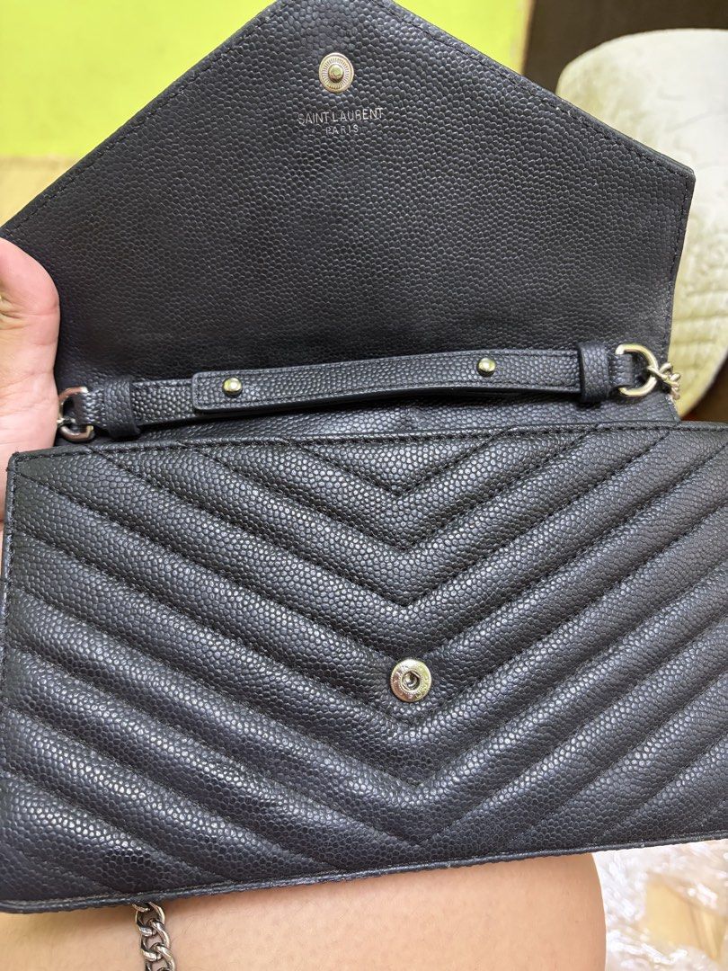 Saint Laurent Black Chevron Wallet on Chain (Category: Luxury Bags & Wallets) located in Saravia. Submitted by clynlyn (Listing ID 1463192135, Image 2). Description: - Authentic Black YSL Wallet on Chain - Elegant Chevron Pattern - Signature Silver YSL Logo - Detachable Chain Strap - Interior Card Slots - Convenient Zip Pocket - Compact and Ideal for Essentials.