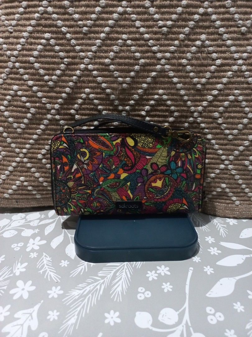 Sakroots Wristlet Wallet - Colorful Pattern (Category: Wallets & Card holders) located in Naga. Submitted by greatchance (Listing ID 1463171484, Image 2). Description: - Cute Sakroots wristlet wallet - Vibrant, colorful paisley-like pattern - Secure clasp closure - Detachable wrist strap - Multiple card slots inside - Zippered compartment for security - Ideal for organizing essentials on the go - Approximate dimensions: 7.5 inches x 4 inches - us