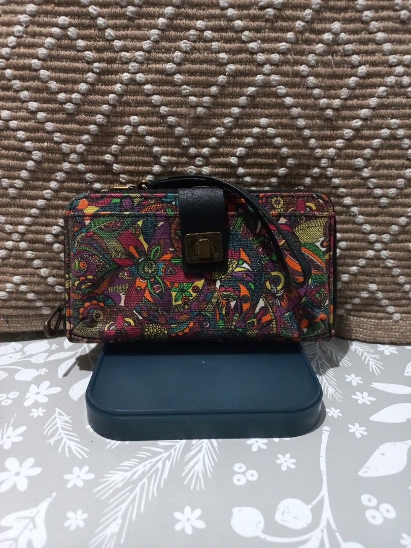 Sakroots Wristlet Wallet - Colorful Pattern (Category: Wallets & Card holders) located in Naga. Submitted by greatchance (Listing ID 1463171484, Image 1). Description: - Cute Sakroots wristlet wallet - Vibrant, colorful paisley-like pattern - Secure clasp closure - Detachable wrist strap - Multiple card slots inside - Zippered compartment for security - Ideal for organizing essentials on the go - Approximate dimensions: 7.5 inches x 4 inches - us