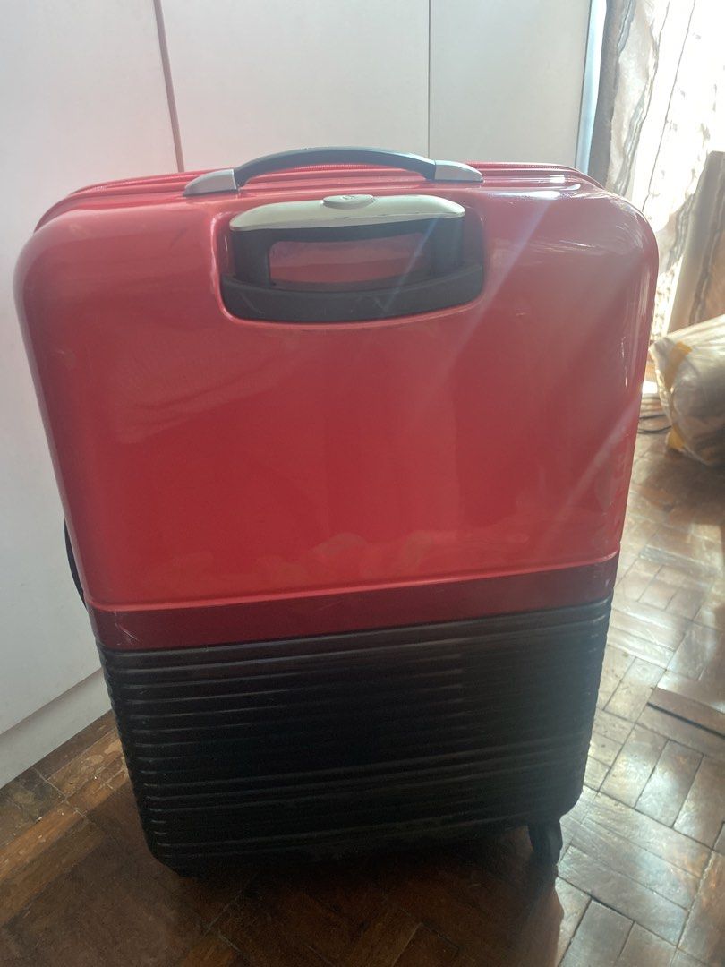 Samsonite RED Red Hardshell Luggage (Category: Luggage) located in Pasig City. Submitted by angelaaaj (Listing ID 1463178294, Image 3). Description: - Samsonite RED hardshell suitcase - Features TSA lock - Wheels are intact and functional - Shows surface scuffs from normal use - Ample interior space for packing.