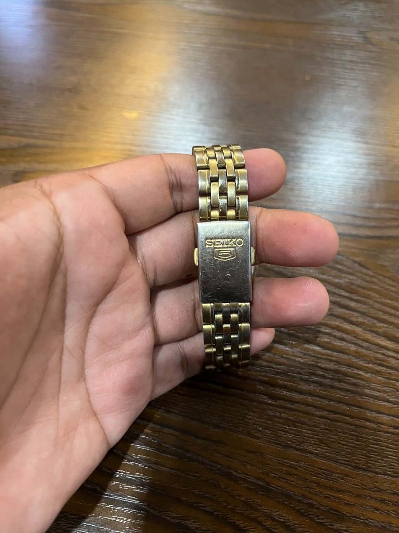 Seiko 5 Automatic Gold Tone Men's Watch (Category: Men's Watches) located in Cebu City. Submitted by jbok_watches. (Listing ID 1463260671, Image 3). Description: - Gold tone Seiko 5 automatic watch - Features day and date display - Stainless steel band - Shows some signs of wear on bracelet and case - Watch is currently running - Selling as is.