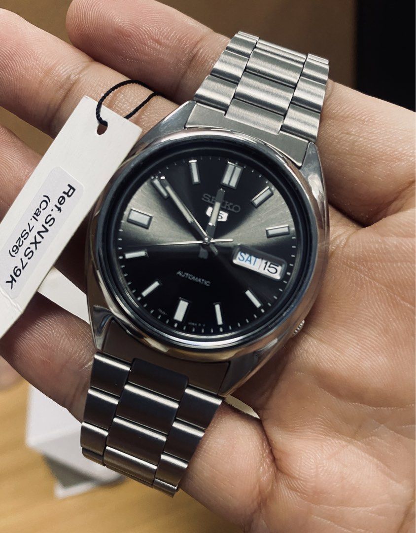 Seiko 5 Automatic Watch SNXS79K (Category: Men's Watches) located in Mabalacat. Submitted by iamyummie (Listing ID 1463210478, Image 1). Description: - Seiko 5 Automatic Watch (Model SNX579K) - Automatic Movement (Visible Case Back) - Includes Box/Hangtag/Card/Manual.