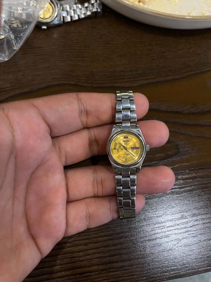 Seiko Automatic Watch Gold Dial (Category: Women's Watches) located in Cebu City. Submitted by jbok_watches. (Listing ID 1463258603, Image 2). Description: - Vintage Seiko Automatic Watch - Unique Gold Checkered Dial - Day and Date Function - Stainless Steel Band - Signs of wear on bracelet and case (consistent with age) - Ideal for collectors or everyday wear.
