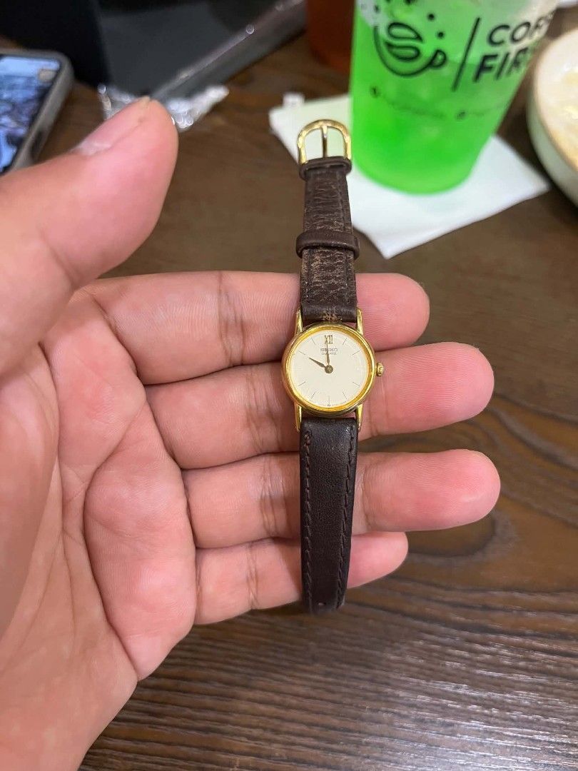 Seiko Quartz Watch Gold Tone Leather Strap (Category: Women's Watches) located in Cebu City. Submitted by jbok_watches. (Listing ID 1463258312, Image 2). Description: - Classic Seiko watch - Gold-tone case - Cream dial with Roman numerals - Quartz movement - Dark brown leather strap - Good working order - Versatile for everyday or dressy occasions.