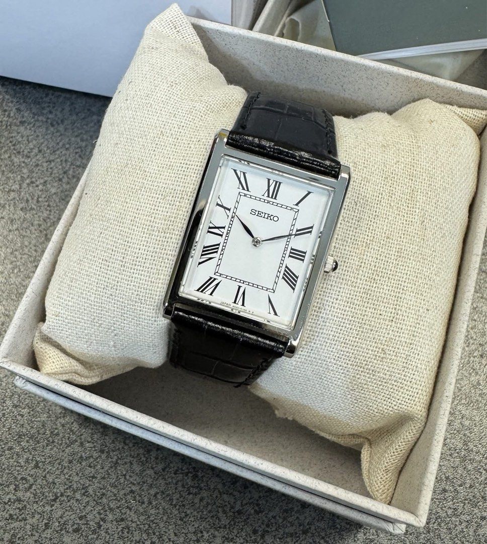 Seiko Tank SWR103 (Category: Luxury Watches) located in Manila. Submitted by seikowatchfactory (Listing ID 1463152151, Image 1). Description: BNIB 10/10 Model: SWR103 Price: 12000 pesos Specifications: Case Diameter: 27.2mm Case Thickness: 6.4mm Lug-to-lug: 39mm Lug Size: 22mm Caliber 4N30 Quartz Movement White Dial Roman Numerals Cow Leather Band Sapphire Crystal Water Resistance: 5 bar Seller is Authorized Dealer of Seiko Japanese Watches Packa