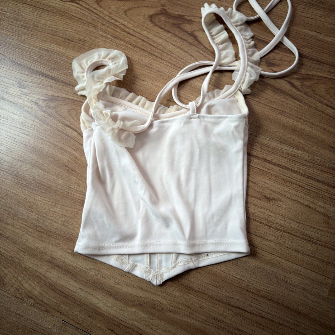 Sheer Ruffle Corset Top - Black & Cream (Category: Sleeveless) located in Paranaque City. Submitted by jlfc_onlineshop (Listing ID 1463188254, Image 2). Description: The price is for the two items already (black and cream) Used once Discount applicable for multiple items No WW photos, No Stains Payment-first basis Bpi/Maya only.