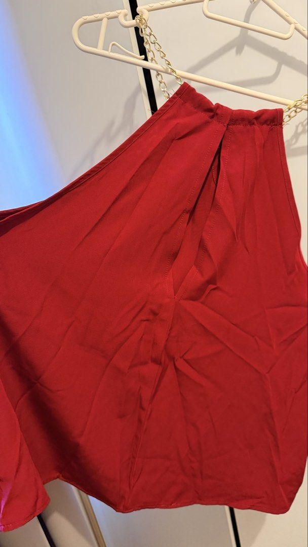 SHEIN CURVE Red Halter Neck Chain Top (Category: Blouses) located in Manila. Submitted by thriftyfinds90 (Listing ID 1463130200, Image 3). Description: - Red halter neck top - SHEIN CURVE brand - Features a chic gold chain detail around the neckline - Elasticated neck for a comfortable and secure fit - Fabric has a lovely drape - Ideal for a night out or special occasion - Versatile piece, easily pairs with skirts or pants.