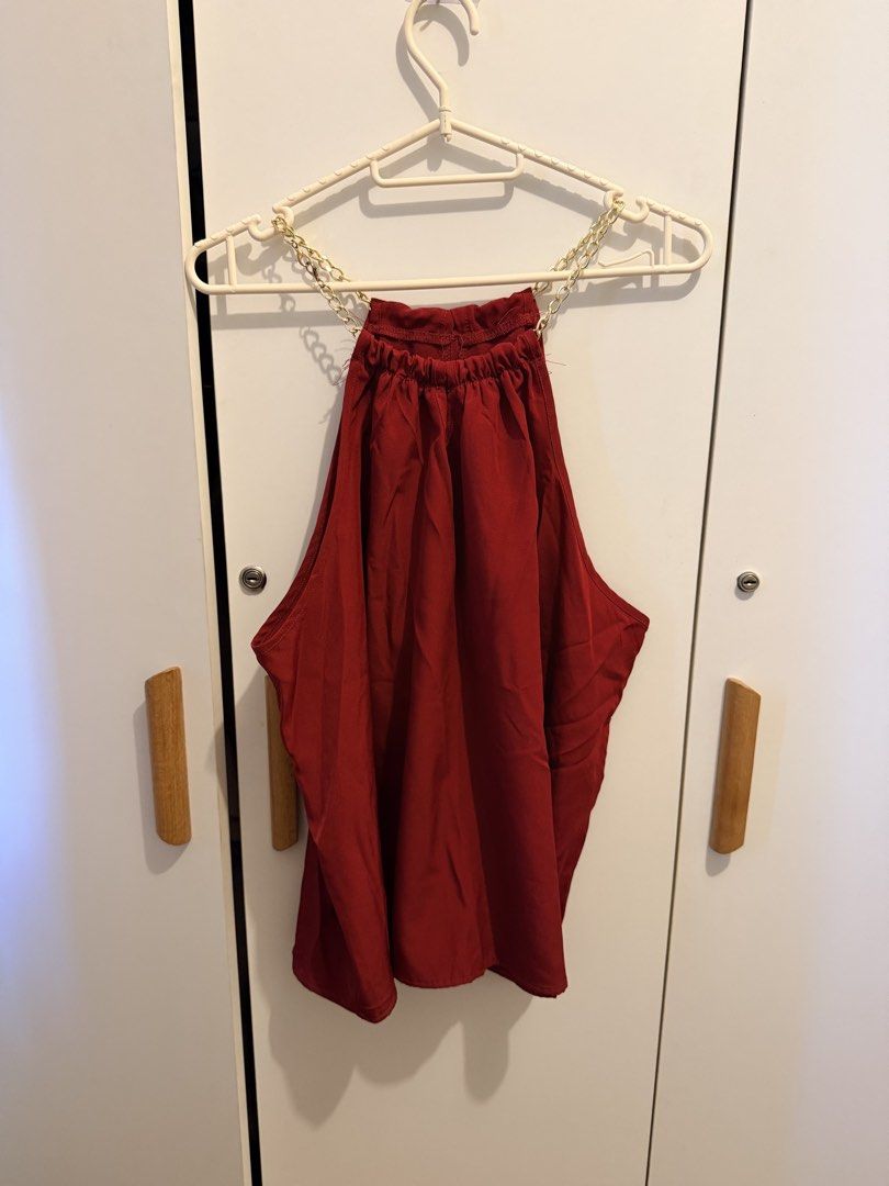SHEIN CURVE Red Halter Neck Chain Top (Category: Blouses) located in Manila. Submitted by thriftyfinds90 (Listing ID 1463130200, Image 1). Description: - Red halter neck top - SHEIN CURVE brand - Features a chic gold chain detail around the neckline - Elasticated neck for a comfortable and secure fit - Fabric has a lovely drape - Ideal for a night out or special occasion - Versatile piece, easily pairs with skirts or pants.