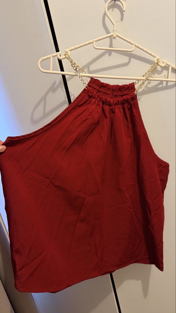 SHEIN CURVE Red Halter Neck Chain Top (Category: Blouses) located in Manila. Submitted by thriftyfinds90 (Listing ID 1463130200, Image 2). Description: - Red halter neck top - SHEIN CURVE brand - Features a chic gold chain detail around the neckline - Elasticated neck for a comfortable and secure fit - Fabric has a lovely drape - Ideal for a night out or special occasion - Versatile piece, easily pairs with skirts or pants.