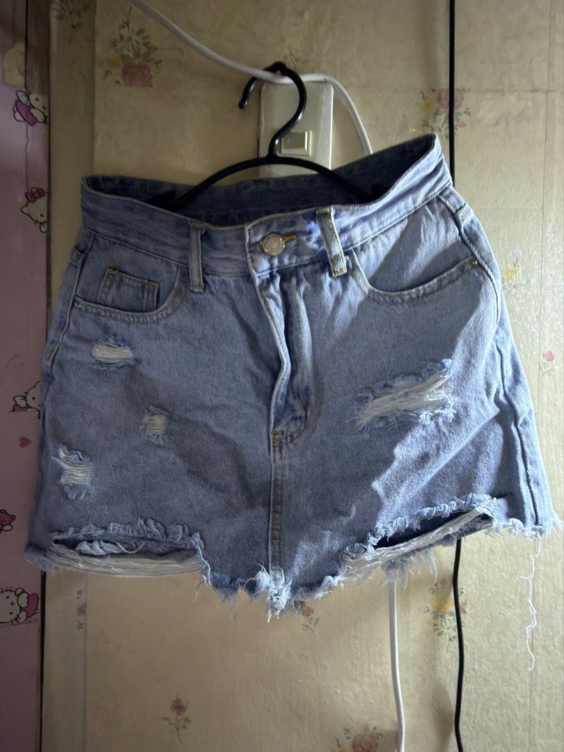 SHEIN Distressed Denim skort Size 27 (Category: Shorts) located in Marikina City. Submitted by chamscouture (Listing ID 1463139551, Image 1). Description: - SHEIN light wash denim skort - Size 27 - Distressed look with rips - Frayed hem - Classic five-pocket styling - Button and zip fly closure - Ideal for casual wear -pm when worn.