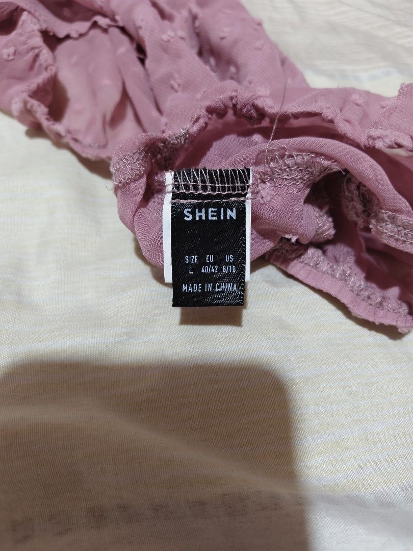 SHEIN Pink Dotted Puff Sleeve Crop Top (Category: Blouses) located in Manila. Submitted by immsuarez (Listing ID 1463310879, Image 2). Description: - Pink crop top from SHEIN - Textured dotted pattern all over - Features a single puff sleeve - Ruched detail for a flattering fit - Super cute and trendy design - Perfect for dressing up or down.