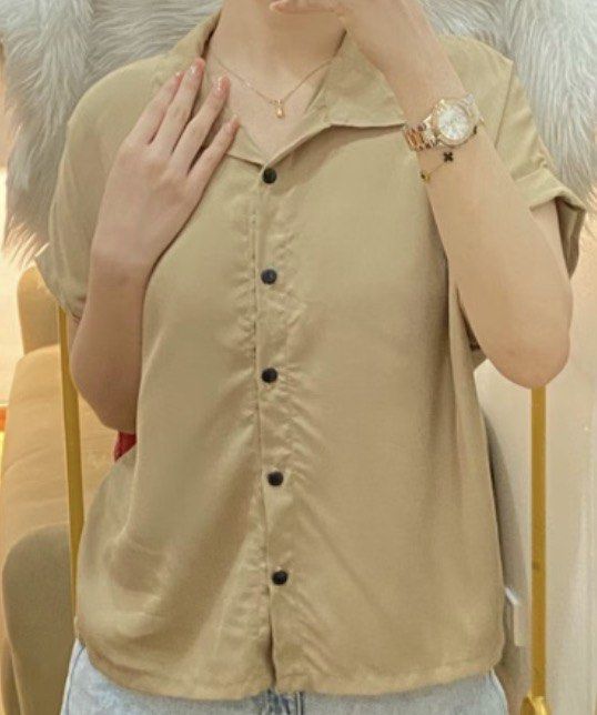 Short Sleeve Collared Shirt - Khaki (Category: Shirts) located in Caloocan City. Submitted by allennaint18459 (Listing ID 1463244591, Image 1). Description: Casual short sleeve shirt with a collared neckline. Button-up front. The fabric has a slight sheen. Looks great paired with jeans or shorts. Easy to wear for everyday outings. Available in khaki color only..