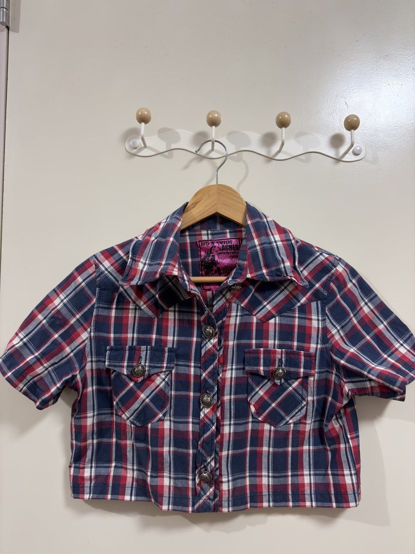Short Sleeve Plaid Button-Up Shirt (Category: Tshirts & Polo Shirts ) located in Manila. Submitted by lily.e0630 (Listing ID 1463288856, Image 1). Description: - Cute short-sleeved plaid shirt - Classic red, white, and blue checkered pattern - Can fit Small-Medium - Two chest pockets with silver-toned button closures - Decorative button design - Cropped style - Ideal for casual outfits.