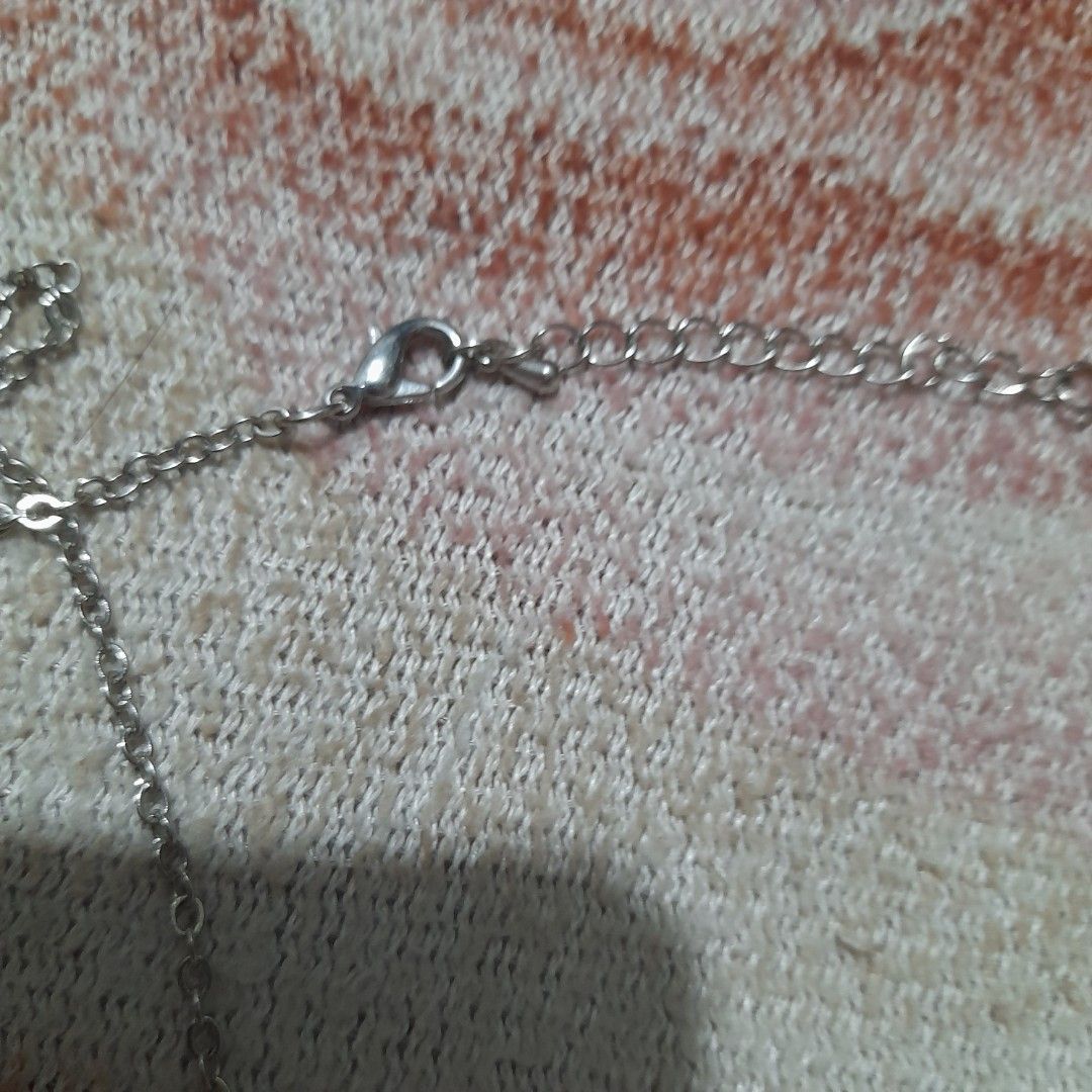 Silver toned Bar Pendant Necklace (Category: Necklaces) located in Bocaue. Submitted by marajapansurplus (Listing ID 1463243432, Image 3). Description: - Simple necklace with a bar pendant - Features five hanging silver bars - Adjustable clasp for a perfect fit - Ideal for everyday wear - Great for layering with other necklaces - Complements casual outfits.