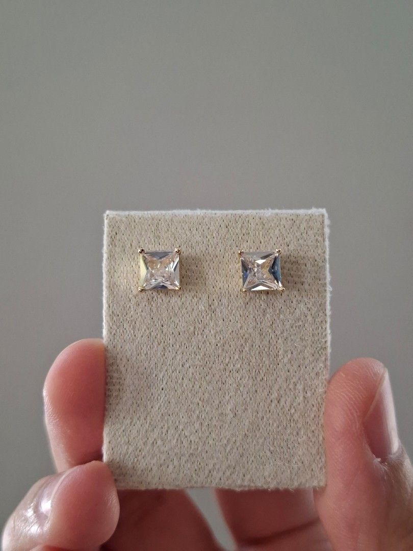 Simple Square Cut Gold Stud Earrings (Category: Earrings) located in Dasmarinas. Submitted by danabrie22 (Listing ID 1463234082, Image 1). Description: very well-made, excellent crafstmanship 10/10 condition brand new stainless steel & white crystal-colored cubic zirconia stones made in Hongkong.