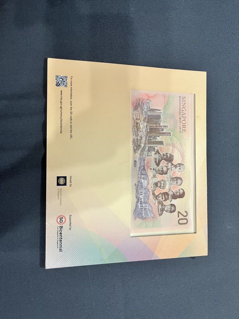 Singapore Bicentennial Commemorative Note SG $20 (Category: Currency) located in Quezon City. Submitted by appleramos2006 (Listing ID 1463275880, Image 2). Description: - Singapore Bicentennial $20 commemorative note - Depicts the nation's journey from past to present - Features portraits of past leaders and iconic landmarks - Issued by the Monetary Authority of Singapore - Ideal for collectors or as a piece of Singapore history.