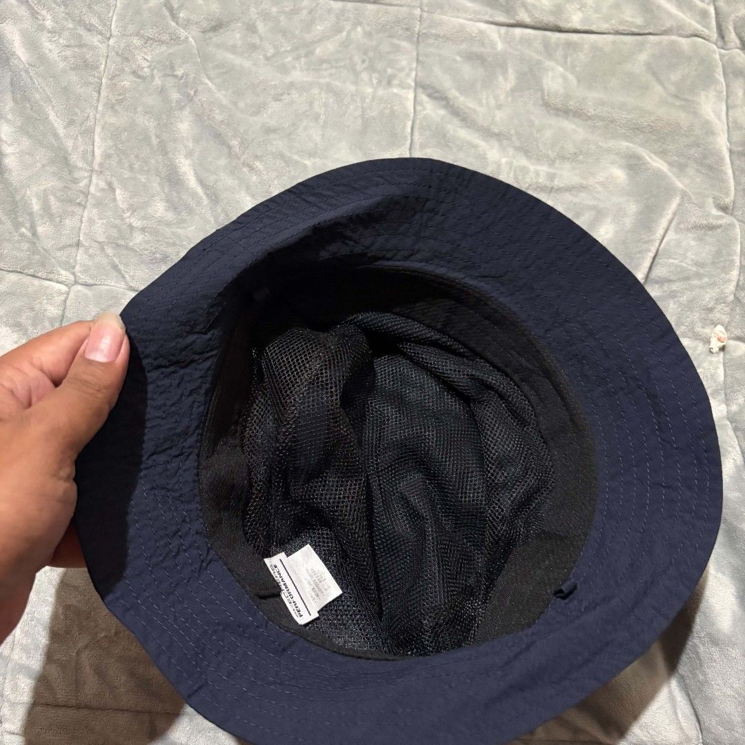 Skechers Performance Bucket Hat Navy Blue (Category: Caps & Hats) located in Carmen. Submitted by ar_thrift00 (Listing ID 1463269410, Image 3). Description: - Skechers navy blue bucket hat - Mesh panels on the sides for enhanced breathability - Adjustable drawstring for a secure and comfortable fit - Prominent 'Performance' logo - Ideal for outdoor adventures and everyday casual style.