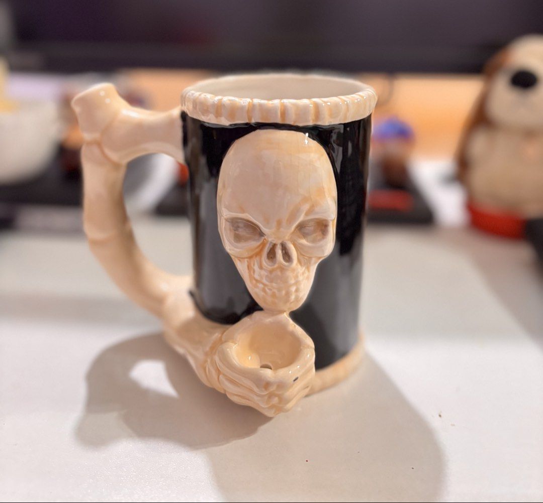 Skull Mug with Skeleton Hands (Category: Coffee & Tea Tableware) located in Bacoor. Submitted by dangeusebio1515 (Listing ID 1460907820, Image 3). Description: - Cool black mug with a unique 3D skull design. - Features skeleton hands holding the bottom of the mug. - Spooky and eye-catching, perfect for Halloween or gothic enthusiasts. - Ideal for enjoying coffee or tea. - A fun conversation starter for your desk or collection..