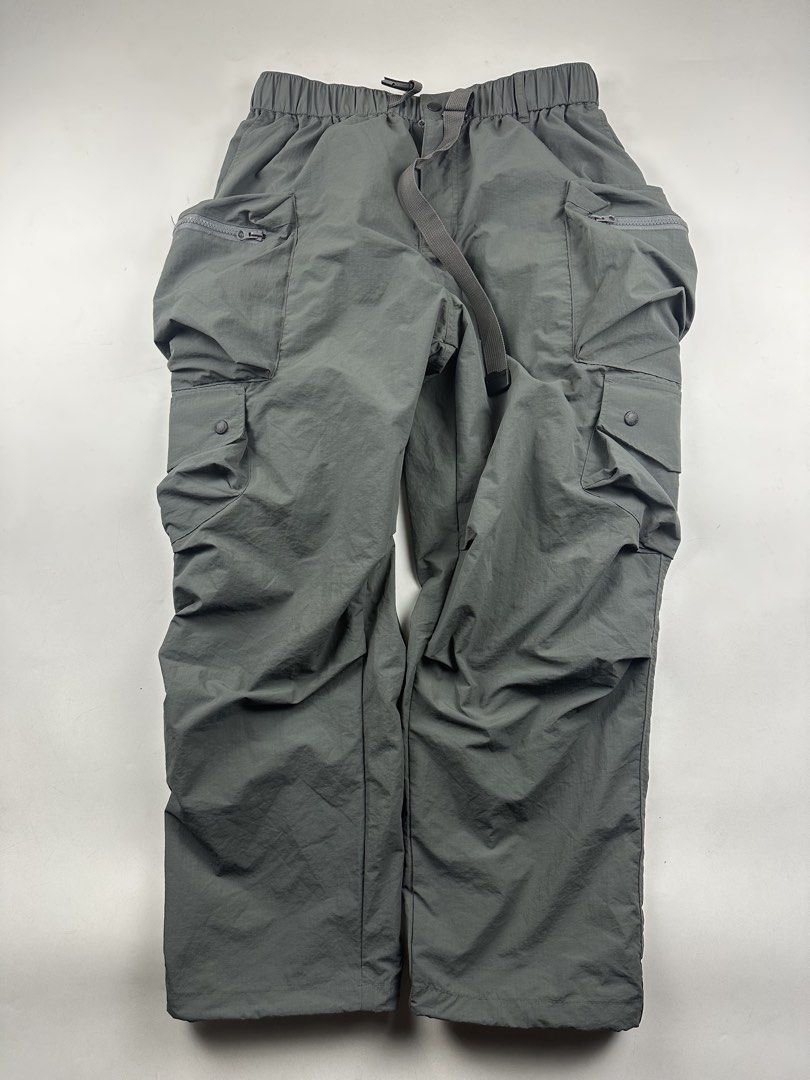 SMKLAB Grey Cargo Pants with Multiple Pockets (Category: Joggers) located in Manila. Submitted by kupal24 (Listing ID 1463243236, Image 1). Description: - Grey cargo pants from SMKLAB - Multiple pockets, some with zippers for secure storage - Comfortable elastic waistband with adjustable drawstring - Versatile for everyday wear or outdoor activities - Brand: Smokinglab Clothing Co. Ltd..