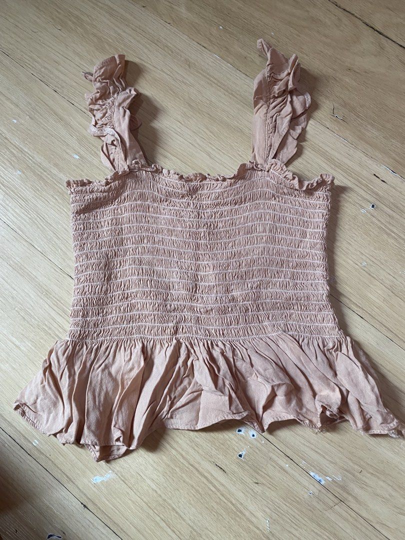 Smocked Ruffle Strap Peplum Top - Nude (Category: Sleeveless) located in Tanauan. Submitted by rie098 (Listing ID 1463277341, Image 2). Description: - Cute nude smocked top - Ruffle straps - Peplum hem for flow - Stretchy smocking all over bodice - Versatile for casual or dressy looks - Easy to pair with jeans or skirts.