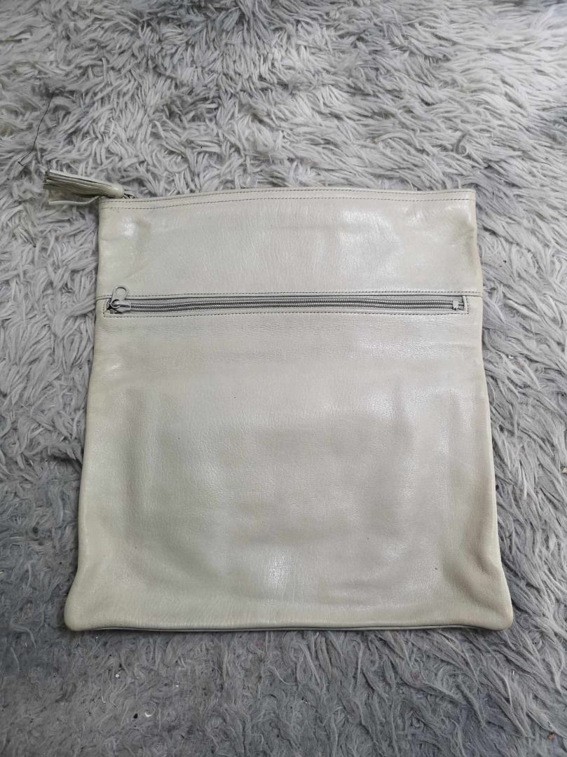 Smooth Soft leather Zipper Closure Cosmetic Pouch (Category: Clutches) located in Santa Cruz. Submitted by jmy_surplus.2 (Listing ID 1463124262, Image 1). Description: Size ; L - 12.4 W - 11.3 Color ; Light Grey Type ; Pouch Brand ; No brand Material ; Leather Style ; Light Grey leather Cosmetic Pouch LR 129 JMY 3 Batch #223.