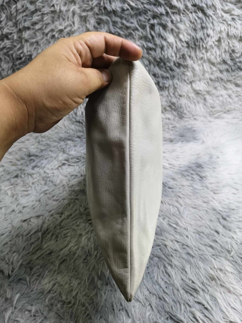 Smooth Soft leather Zipper Closure Cosmetic Pouch (Category: Clutches) located in Santa Cruz. Submitted by jmy_surplus.2 (Listing ID 1463124262, Image 2). Description: Size ; L - 12.4 W - 11.3 Color ; Light Grey Type ; Pouch Brand ; No brand Material ; Leather Style ; Light Grey leather Cosmetic Pouch LR 129 JMY 3 Batch #223.