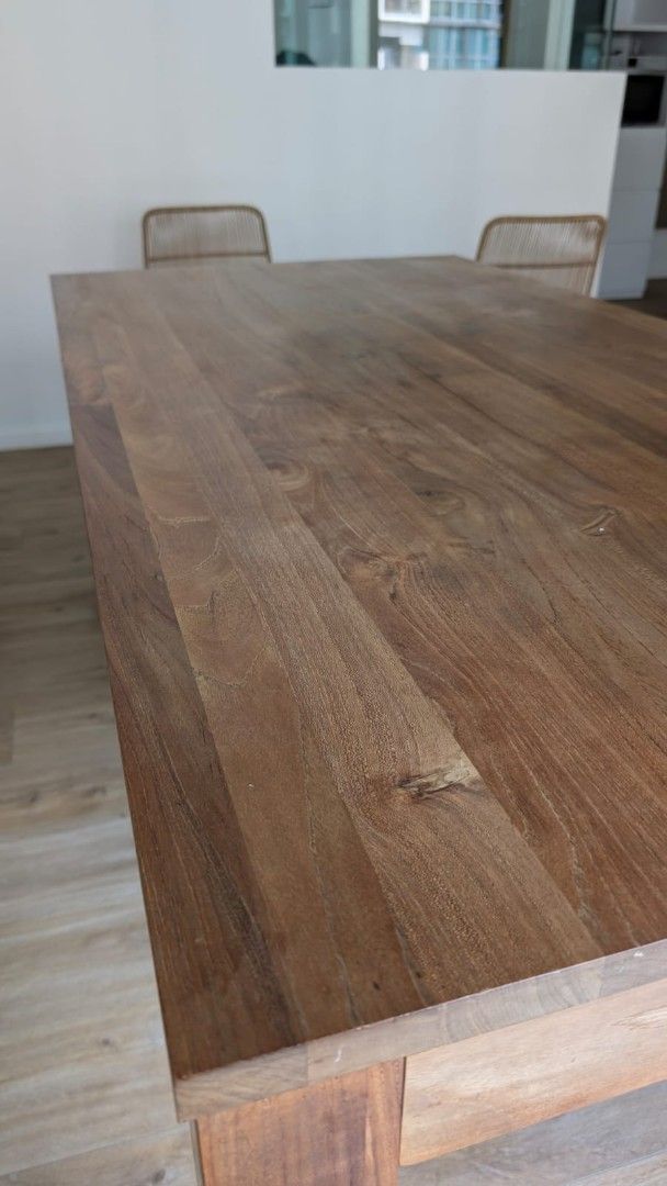 Solid Wood Dining Table (Category: Tables & Sets) located in Singapore. Submitted by vivienlm (Listing ID 1463233093, Image 3). Description: - Solid wood dining table - Natural wood grain finish - Sturdy construction with thick legs - Chairs and bench from other listings in my profile can be sold together as a bundle or separately - Perfect for family meals & entertaining - Selling due to redecoration - Pick up only.