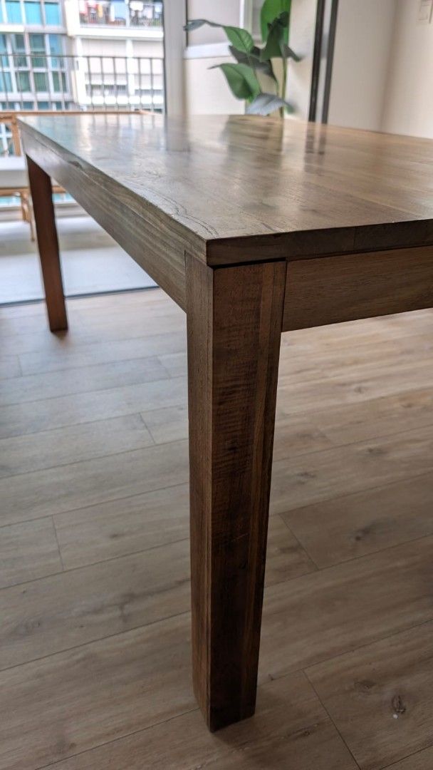 Solid Wood Dining Table (Category: Tables & Sets) located in Singapore. Submitted by vivienlm (Listing ID 1463233093, Image 1). Description: - Solid wood dining table - Natural wood grain finish - Sturdy construction with thick legs - Chairs and bench from other listings in my profile can be sold together as a bundle or separately - Perfect for family meals & entertaining - Selling due to redecoration - Pick up only.