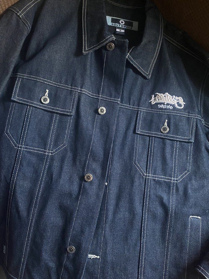SOUTHPOLE Denim Jacket (RARE) (Category: Coats, Jackets and Outerwear) located in Manila. Submitted by wheeze_2208 (Listing ID 1463179463, Image 1). Description: -Read this before proceeding to message me - Only tried fitting it and never wore it outside - Classic dark wash denim jacket by Southpole - Features contrast stitching and embroidered logo - Button front closure - Two chest pockets - Made from 100% cotton - Versatile staple piece for an