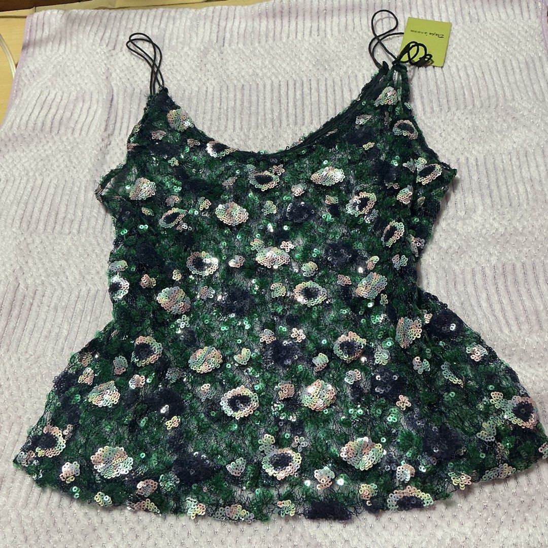 Sparkly Sequins Floral Mesh Cami Top (Category: Sleeveless) located in Manila. Submitted by daisyparl (Listing ID 1463259272, Image 1). Description: - Green mesh cami top - Floral sequin details - Thin spaghetti straps - Flattering peplum hem - Ideal for parties or a night out - Very eye-catching design - Versatile: pair with jeans or a skirt.