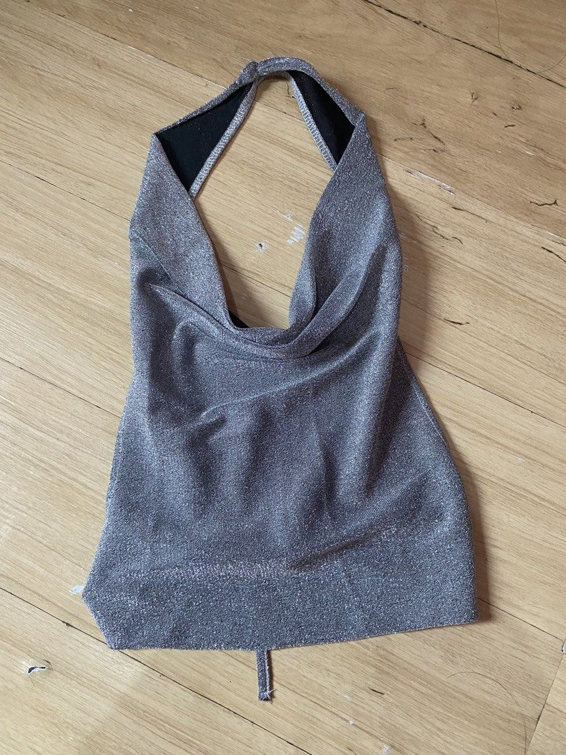 Sparkly Silver Halter Top (Category: Sleeveless) located in Tanauan. Submitted by rie098 (Listing ID 1463276073, Image 3). Description: - WORN ONCE - Sparkly silver halter top - Elegant cowl neck design - Ties at the back for adjustable fit - Perfect for parties, nights out, or special occasions - Fabric has a beautiful shimmer that catches the light - Comfortable and eye-catching.