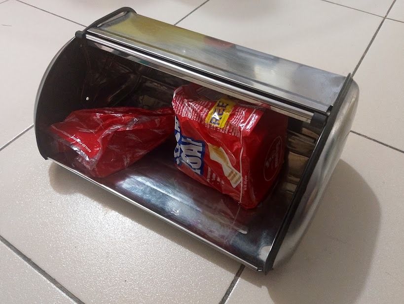 Stainless steel bread box (Category: Cookware & Accessories) located in Quezon City. Submitted by susmaryosep1 (Listing ID 1463255853, Image 2). Description: Stainless steel bread box to keep bread fresh - Easy access with roll-top lid - Sleek design complements any kitchen counter - Ideal for storing bread, pastries, and baked goods 1k.
