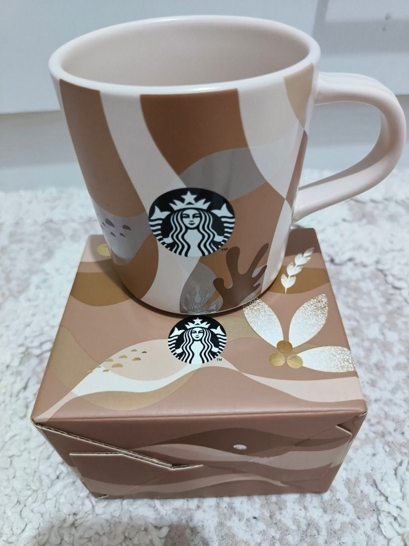 Starbucks Mug with Box 12 fl oz / 355 mL (Category: Coffee & Tea Tableware) located in Caloocan City. Submitted by adidaszler (Listing ID 1463129826, Image 1). Description: - Starbucks Mug - Capacity: 12 fl oz (355 mL) - Material: Porcelain - Microwave and Dishwasher Safe - Includes Original Box - Ideal for coffee or tea.