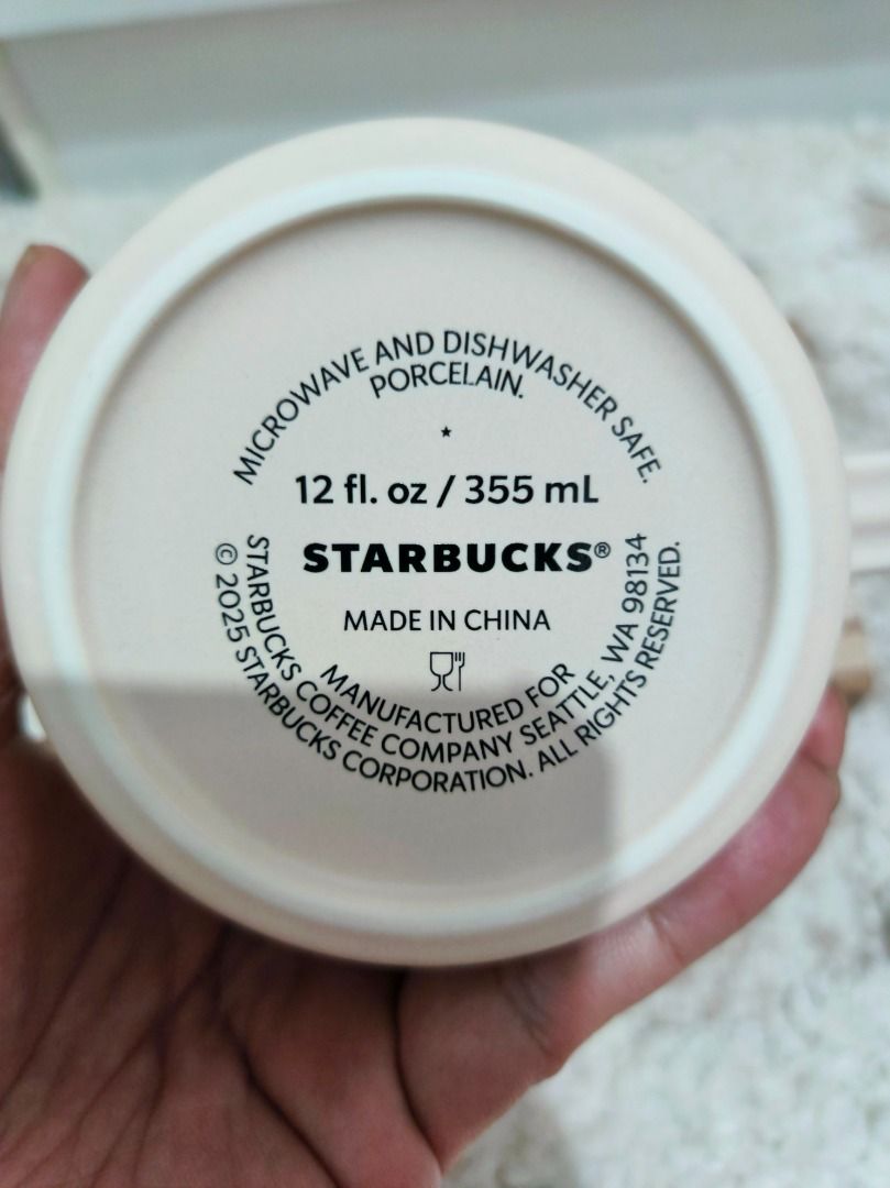 Starbucks Mug with Box 12 fl oz / 355 mL (Category: Coffee & Tea Tableware) located in Caloocan City. Submitted by adidaszler (Listing ID 1463129826, Image 3). Description: - Starbucks Mug - Capacity: 12 fl oz (355 mL) - Material: Porcelain - Microwave and Dishwasher Safe - Includes Original Box - Ideal for coffee or tea.