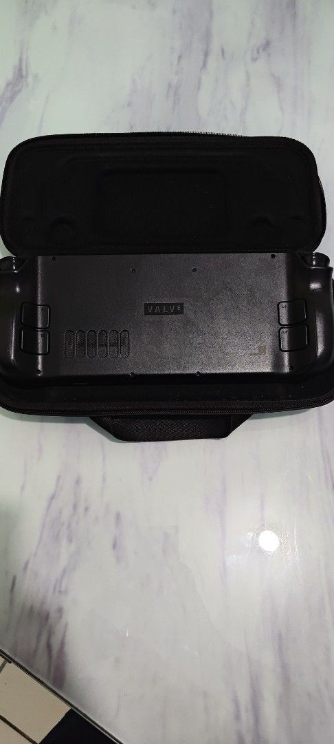 Steam Deck 256GB Handheld Gaming PC (Category: Others) located in Manila. Submitted by rs282 (Listing ID 1463187004, Image 2). Description: - Valve Steam Deck 256 LCD - Ideal for PC gaming on the go - Includes original carrying case - With charger - Tested and fully functional - Ready for a new owner - Mode of Payment - Cash.