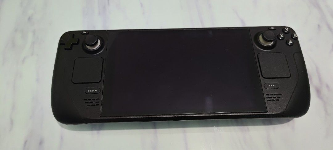 Steam Deck 256GB Handheld Gaming PC (Category: Others) located in Manila. Submitted by rs282 (Listing ID 1463187004, Image 1). Description: - Valve Steam Deck 256 LCD - Ideal for PC gaming on the go - Includes original carrying case - With charger - Tested and fully functional - Ready for a new owner - Mode of Payment - Cash.