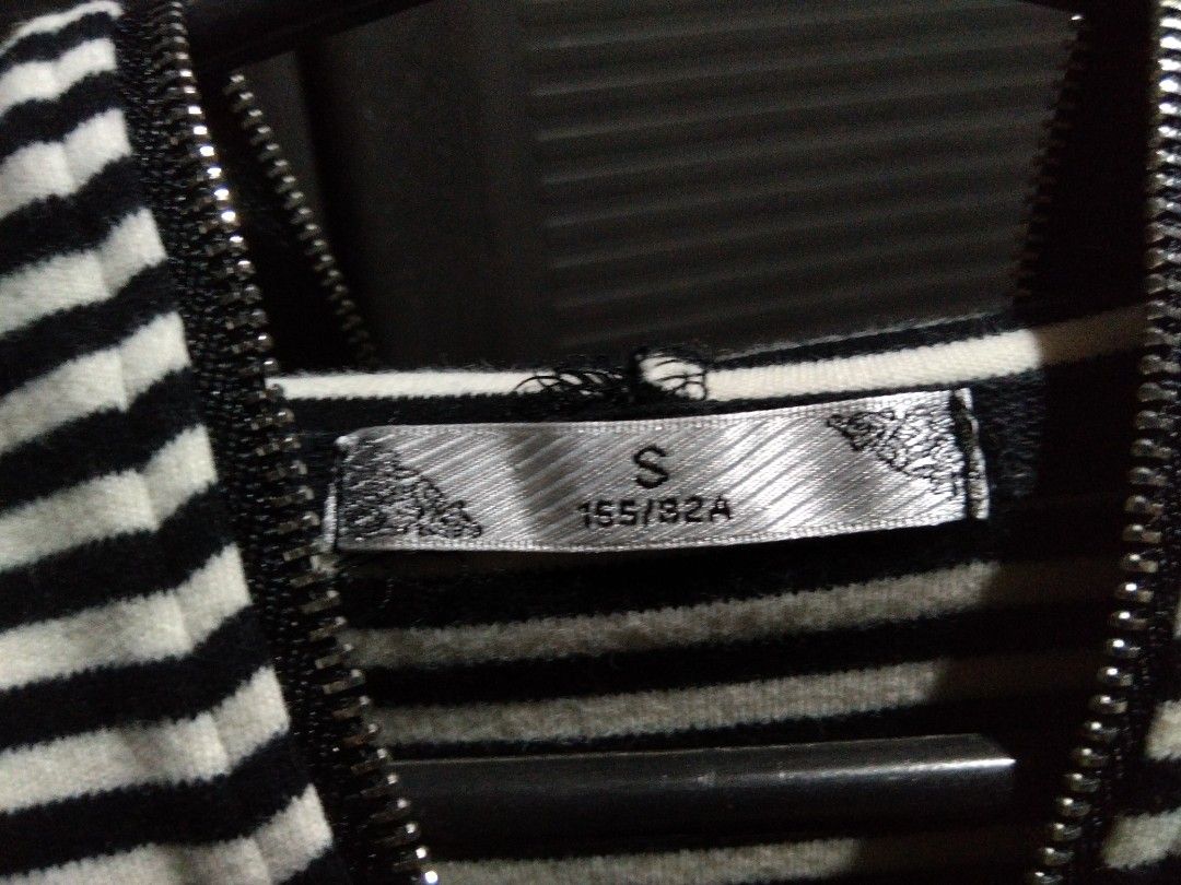 Striped Long-Sleeved Top with Zipper Neck (Category: Longsleeves) located in Asingan. Submitted by nickchacon (Listing ID 1463160599, Image 3). Description: - Fits S-M - Classic black and white stripes - Long sleeves - Zipper detail at the neckline - Comfortable fabric for everyday wear - Versatile: pairs easily with jeans or skirts - Great for casual occasions - Can be worn alone or layered.