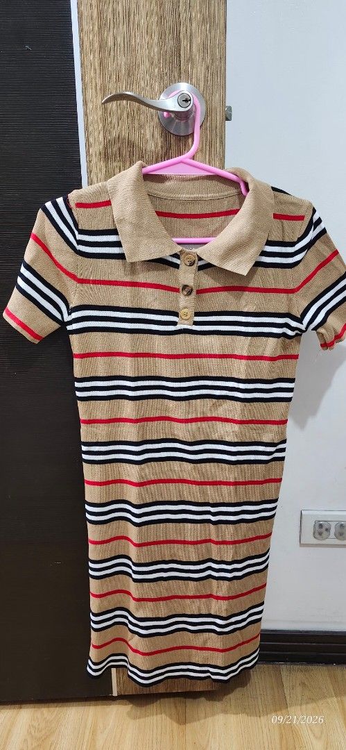 Striped Polo Shirt with Buttons (Category: Dresses) located in Manila. Submitted by atan2025 (Listing ID 1463230502, Image 1). Description: - Tan polo shirt - Red, black, and white stripe details - Classic collar with 3-button placket - Short sleeves - Comfortable knit fabric - Ideal for casual outings.
