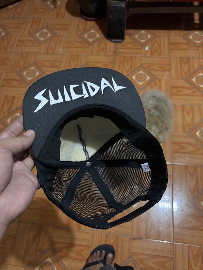 Suicidal Tendencies Black Mesh Trucker Cap (Category: Caps & Hats) located in Polomolok. Submitted by rrthrift (Listing ID 1463236707, Image 3). Description: - Black trucker cap with Suicidal Tendencies logo - Mesh back for breathability - Adjustable snapback closure - "Made in USA" tag inside - Ideal for fans of the band.
