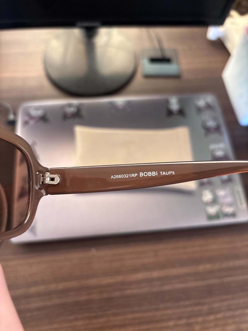 Sunnies Sunglasses with Case (Category: Sunglasses & Eyewear) located in Cabuyao City. Submitted by dumbonita (Listing ID 1463224959, Image 2). Description: - Brown tinted sunglasses - Thick frame design - Comes with a light brown protective case - Case features '10 Years of Sunnies' logo - Sunglasses arm details: '62460032 RRP BORRI' - Ideal for sunny weather.