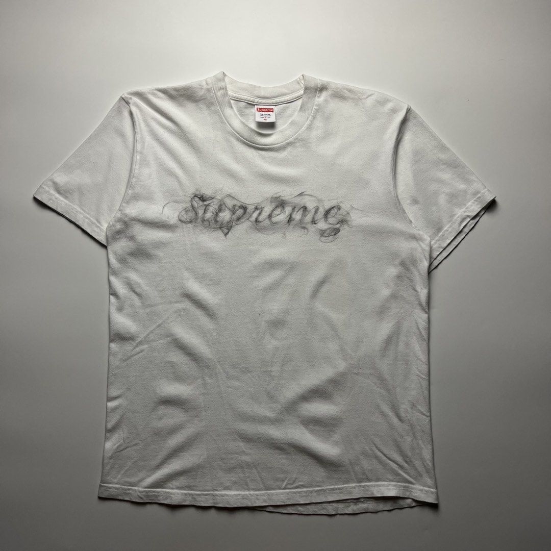 Supreme FW19 Smoke Tee (Category: Tshirts & Polo Shirts ) located in Manila. Submitted by streetsavvy (Listing ID 1463224141, Image 1). Description: Supreme FW19 Smoke Tee Size: Medium Width: 20” Length: 26” Shoulder: 17.5 Sleeve Length: 8” Hem: 21” Measured in Inches Condition: Very good condition with signs of wear Flaw: Minor lints (removable) Made in U.S.A. 100% Cotton.