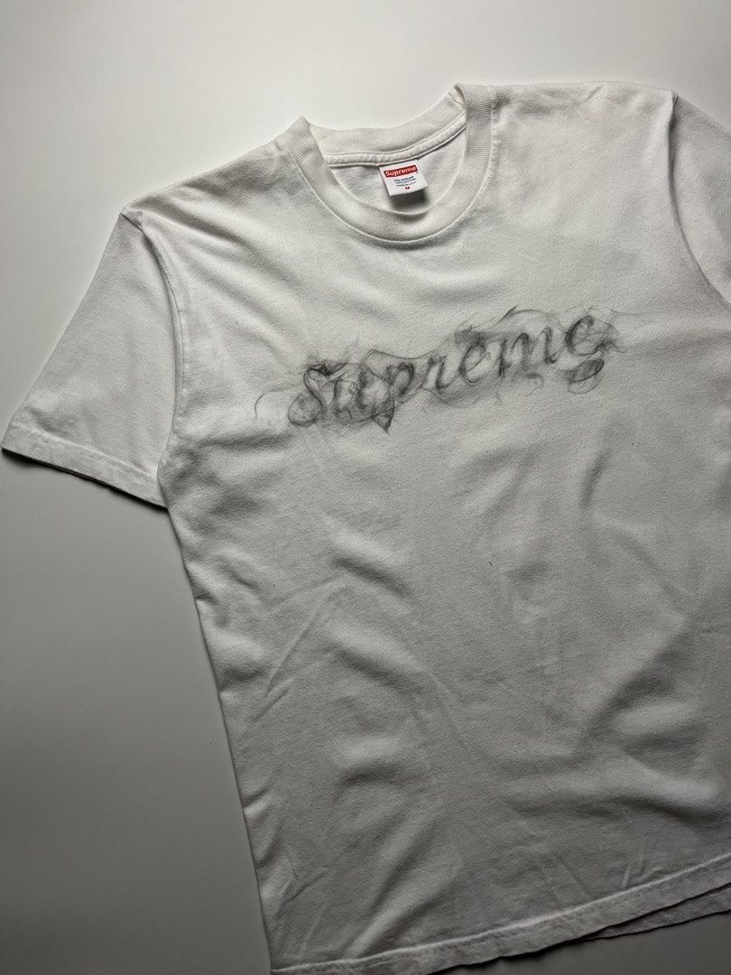 Supreme FW19 Smoke Tee (Category: Tshirts & Polo Shirts ) located in Manila. Submitted by streetsavvy (Listing ID 1463224141, Image 2). Description: Supreme FW19 Smoke Tee Size: Medium Width: 20” Length: 26” Shoulder: 17.5 Sleeve Length: 8” Hem: 21” Measured in Inches Condition: Very good condition with signs of wear Flaw: Minor lints (removable) Made in U.S.A. 100% Cotton.