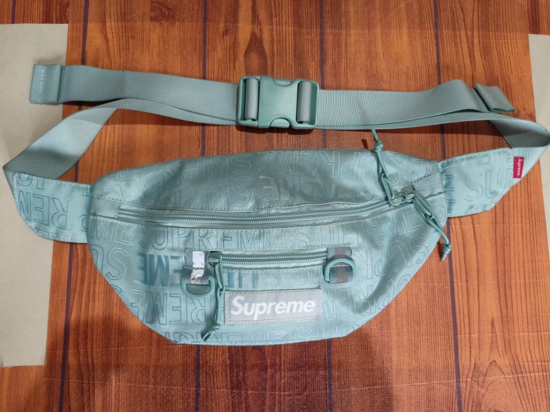 Supreme SS21 Monogram Waist Bag Aqua (Category: Luxury Bags & Wallets) located in Abucay. Submitted by vcc.plug (Listing ID 1463175606, Image 1). Description: - Aqua blue Supreme waist bag - All-over monogram print - Two zip compartments - Adjustable strap with buckle - Made with durable Cordura fabric - Ideal for everyday use or travel - Keep your essentials secure and accessible.