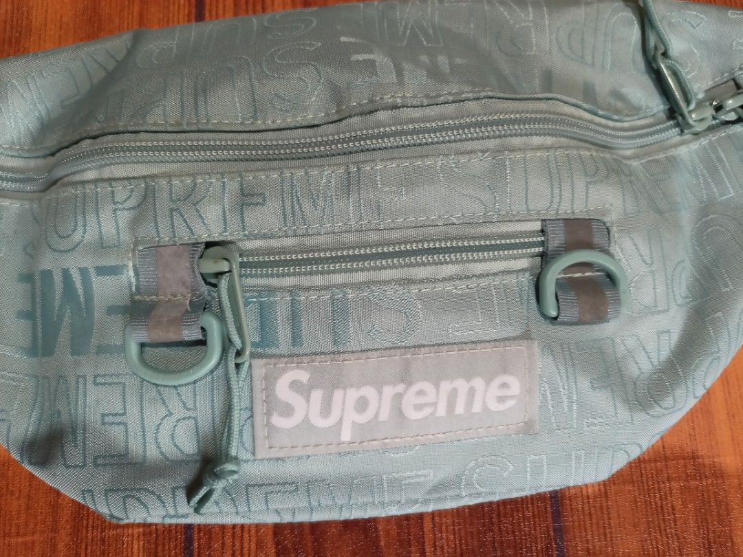 Supreme SS21 Monogram Waist Bag Aqua (Category: Luxury Bags & Wallets) located in Abucay. Submitted by vcc.plug (Listing ID 1463175606, Image 3). Description: - Aqua blue Supreme waist bag - All-over monogram print - Two zip compartments - Adjustable strap with buckle - Made with durable Cordura fabric - Ideal for everyday use or travel - Keep your essentials secure and accessible.