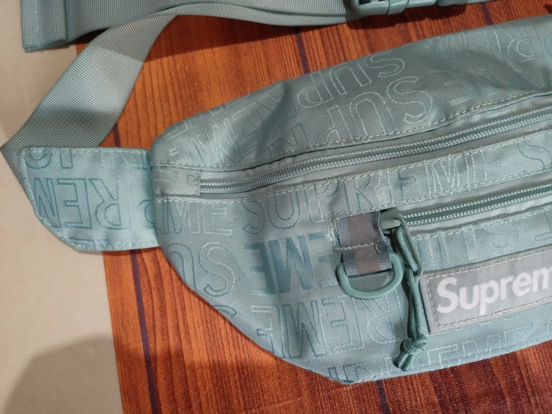 Supreme SS21 Monogram Waist Bag Aqua (Category: Luxury Bags & Wallets) located in Abucay. Submitted by vcc.plug (Listing ID 1463175606, Image 2). Description: - Aqua blue Supreme waist bag - All-over monogram print - Two zip compartments - Adjustable strap with buckle - Made with durable Cordura fabric - Ideal for everyday use or travel - Keep your essentials secure and accessible.