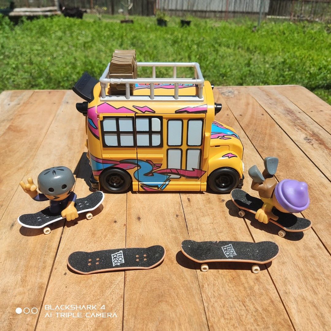 Tech Deck Sk8 Crew Bus Playset with Figures and Skateboards (Category: Action & Battle Toys) located in Bugallon. Submitted by ariel013 (Listing ID 1463161664, Image 2). Description: - Awesome Tech Deck Sk8 Crew bus playset - Opens to reveal an interior skate ramp - Includes 2 figures and 4 skateboards - Features a cool bus design with a top rack - All pieces are complete and ready for play - Great gift for any Tech Deck enthusiast.