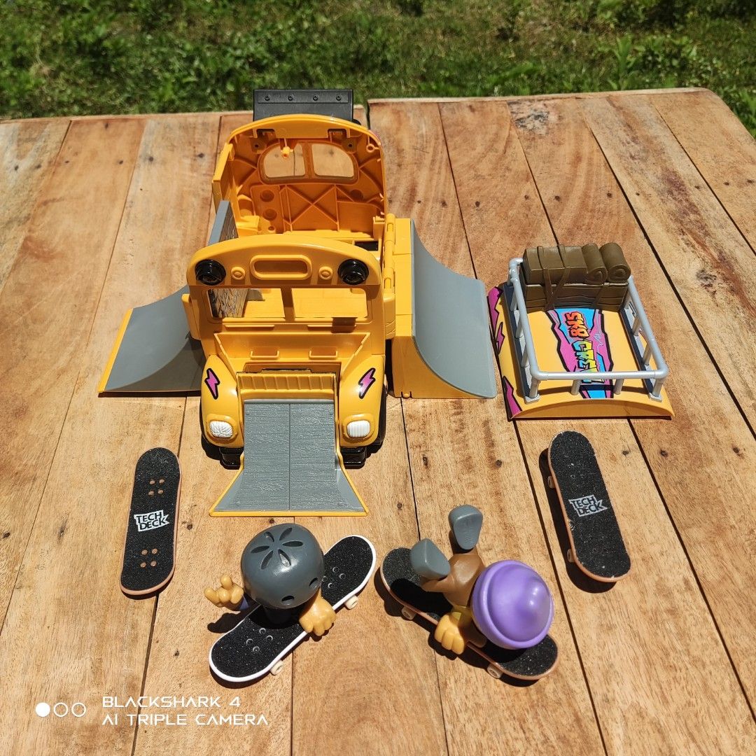 Tech Deck Sk8 Crew Bus Playset with Figures and Skateboards (Category: Action & Battle Toys) located in Bugallon. Submitted by ariel013 (Listing ID 1463161664, Image 3). Description: - Awesome Tech Deck Sk8 Crew bus playset - Opens to reveal an interior skate ramp - Includes 2 figures and 4 skateboards - Features a cool bus design with a top rack - All pieces are complete and ready for play - Great gift for any Tech Deck enthusiast.
