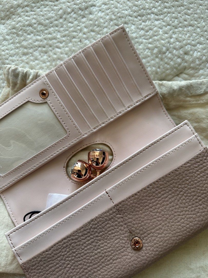 Ted Baker London Wallet (Category: Wallets & Card holders) located in Quezon City. Submitted by kianabanq (Listing ID 1463247827, Image 3). Description: Ted Baker London Pink Leather Wallet with Rose Gold Clasp AUTHENTIC 💯 - Genuine Ted Baker London wallet - Chic pink pebbled leather - Elegant rose gold clasp with sparkling crystal details - Ample card slots for all your essentials - Secure zip pocket for coins or small items - Comes with origin