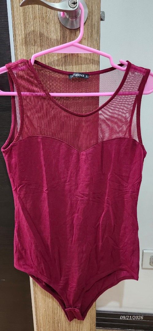 Terranova Burgundy Mesh Bodysuit Size L (Category: Others Tops) located in Manila. Submitted by atan2025 (Listing ID 1463222022, Image 1). Description: - Burgundy bodysuit from Terranova - Size: Large (L) - Features mesh detailing on chest and shoulders - Sleeveless design - Versatile: Great for layering or wearing on its own - Comfortable and stylish.